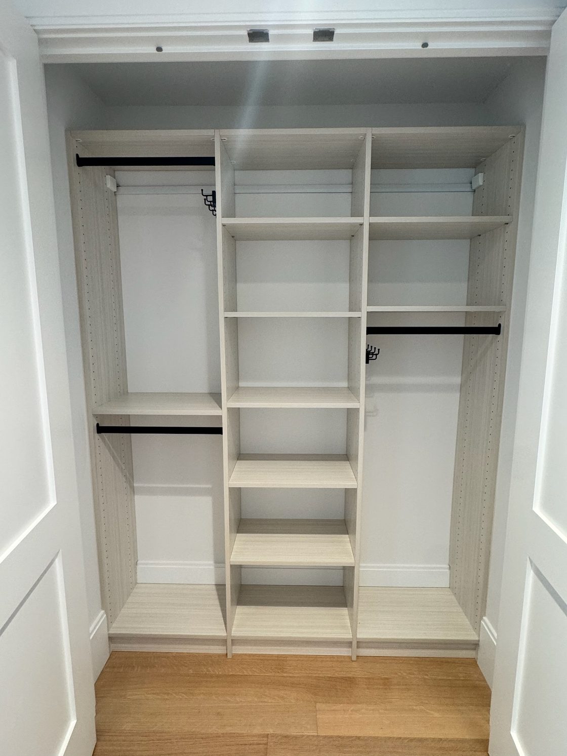 Custom reach in closet with double hang sections and open shelving