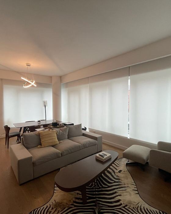 Downtown Residence — Living room with whole-home motorized shades