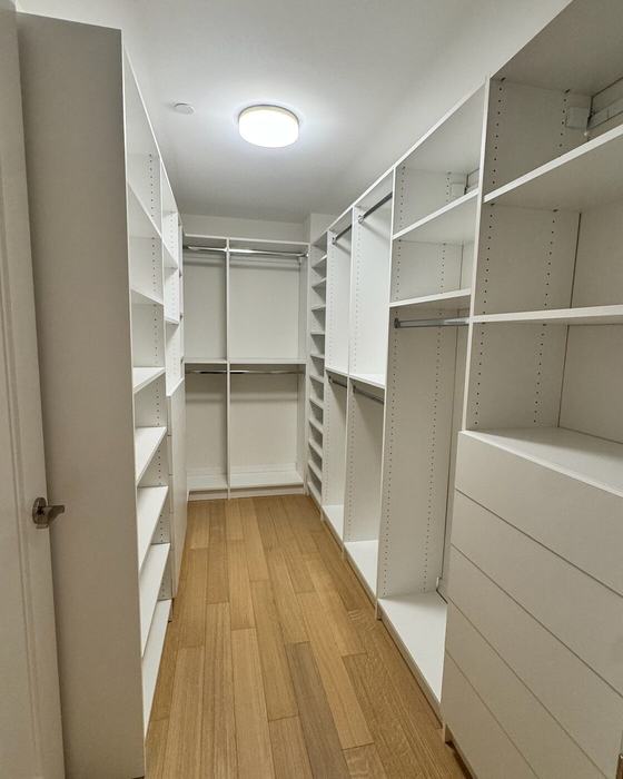 Pre-war walk-in closet in white laminate, custom fit