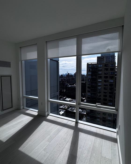 Corner residence primary bedroom with custom shades