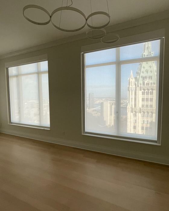 Tribeca overlook with motorized sheer shades and landmark view
