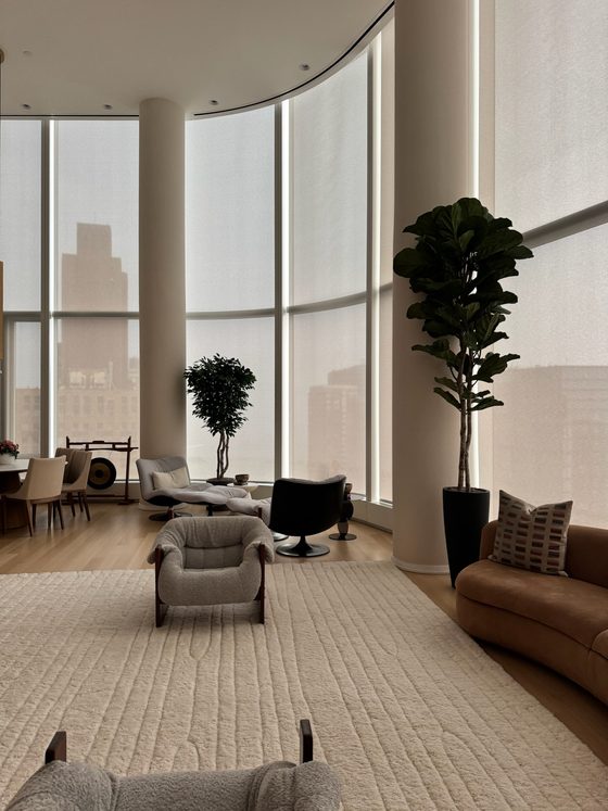 Motorized roller shades on curved floor to ceiling glass, Manhattan residence